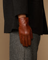 Men's leather glove with fur-lined cuff showing full hand silhouette