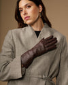 Long dark brown leather gloves with smooth, fitted design