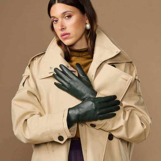 Pair of dark green leather long gloves with snug fit at the wrists