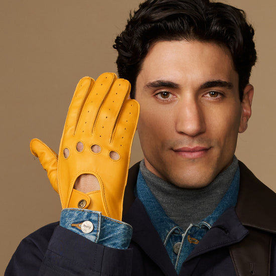 Men's lambskin driving gloves in yellow, touchscreen fingertips, perforated details