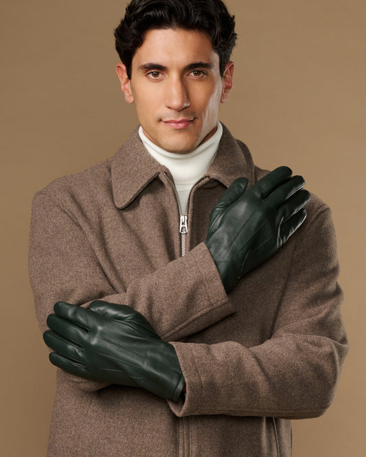 Dark green Jake sheepskin gloves with warm fleece lining, model arms crossed