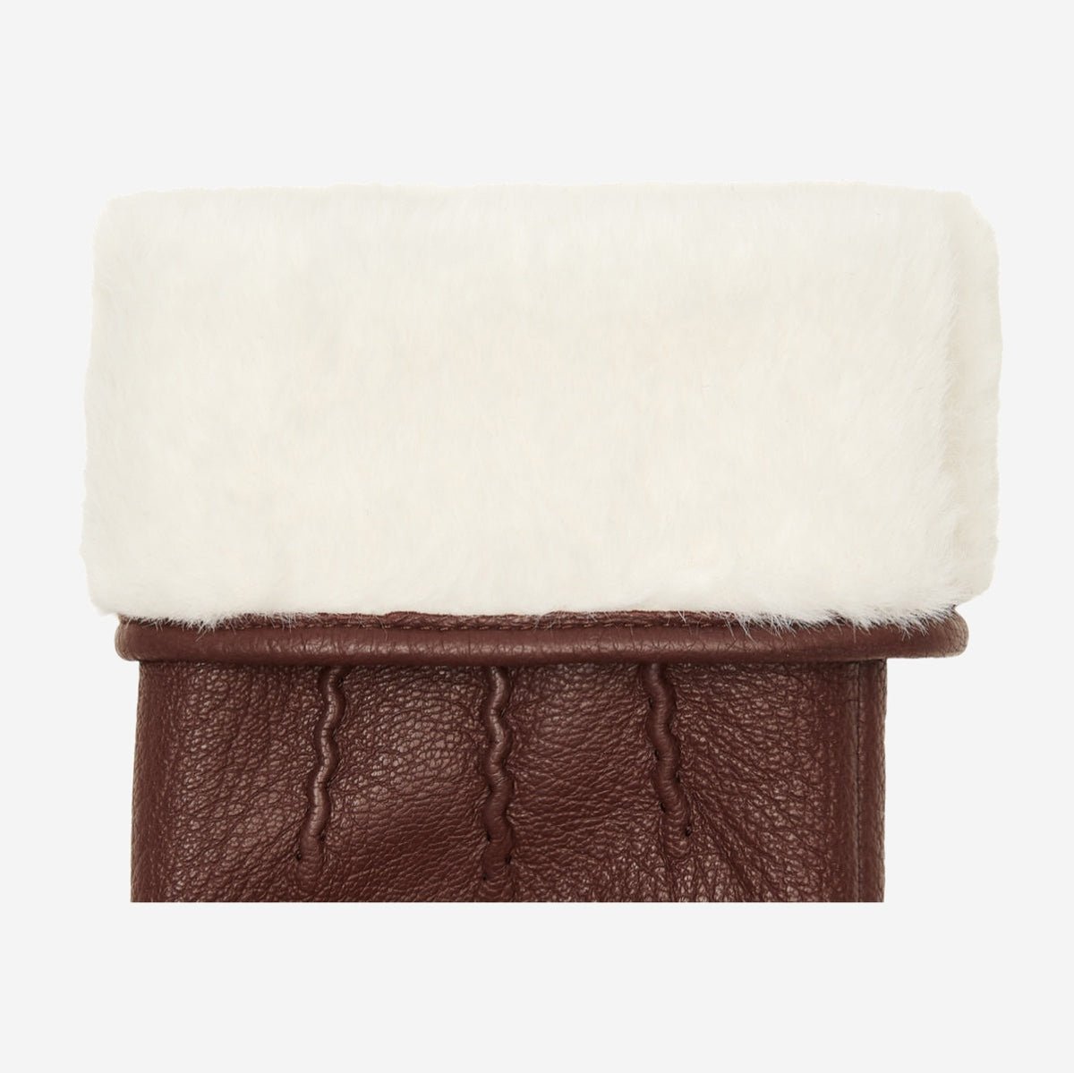 Brown leather glove cuff with plush white faux fur trim