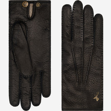 Women's black leather gloves with finger seams and gold emblem on back