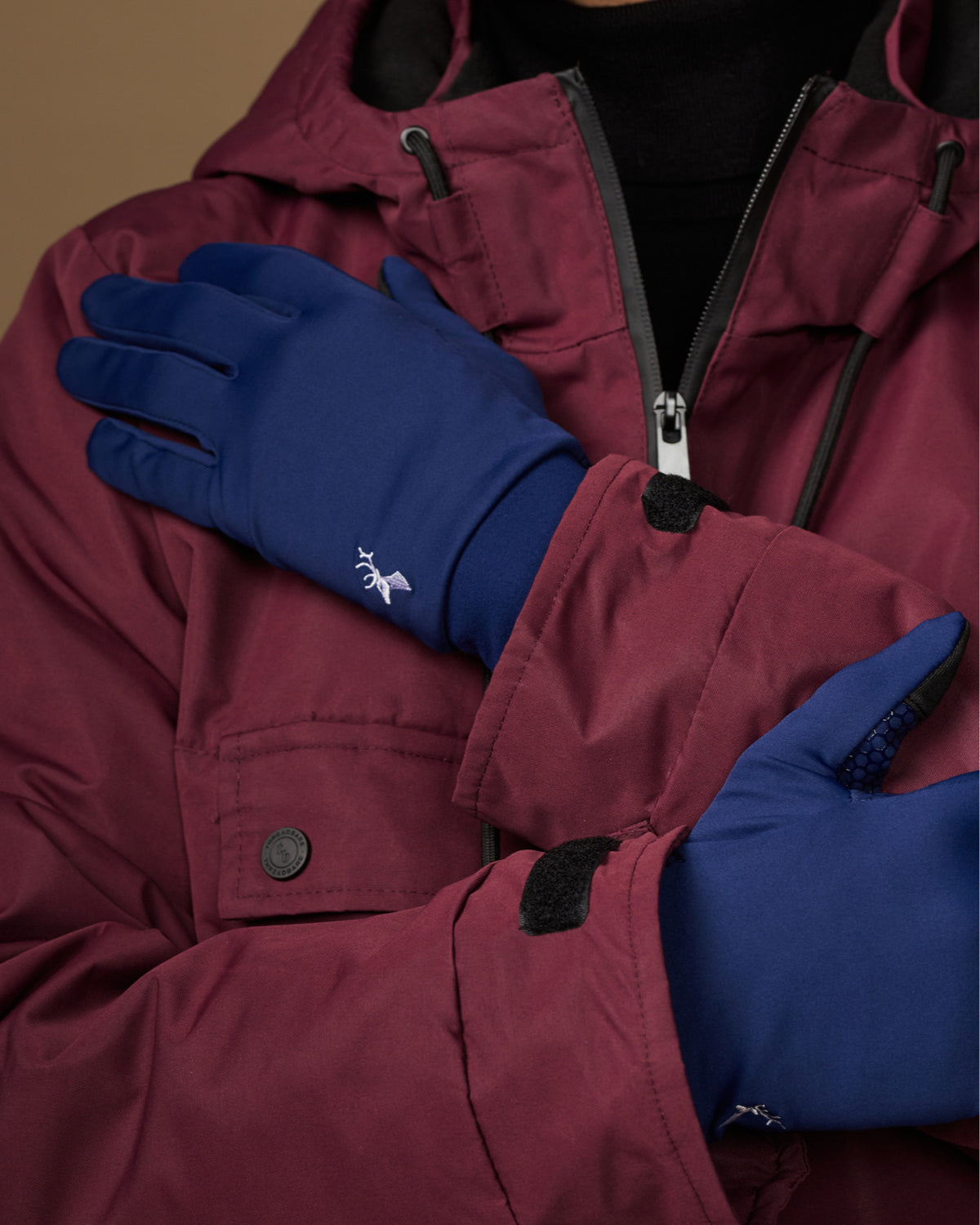 Blue activity gloves with smooth backs and small white logo