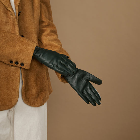 Single dark green leather glove stretched out, showing finger seams and stitched cuff