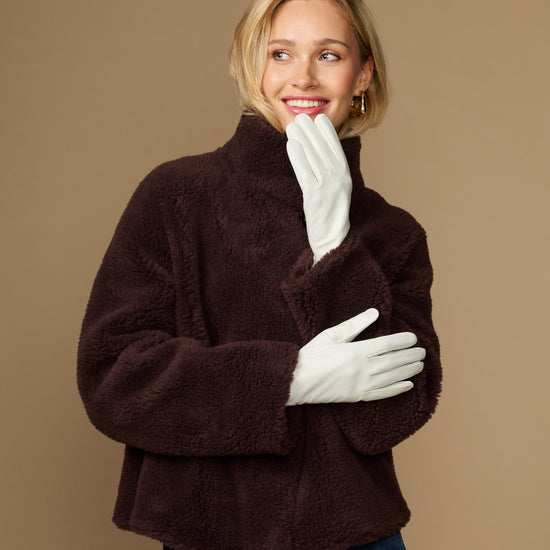 Women’s white leather gloves with smooth lining, full-finger design and flexible fit
