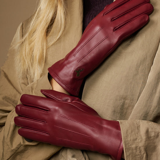 Bordeaux leather gloves with stitched finger panels and fleece-lined cuffs