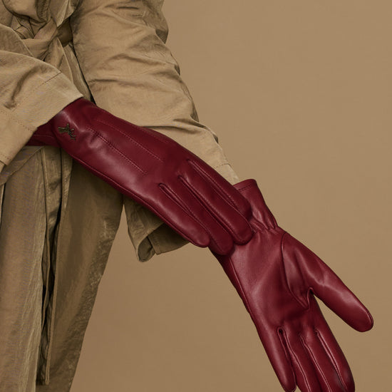 Bordeaux leather gloves, side view showing stitched fingers and long cuff