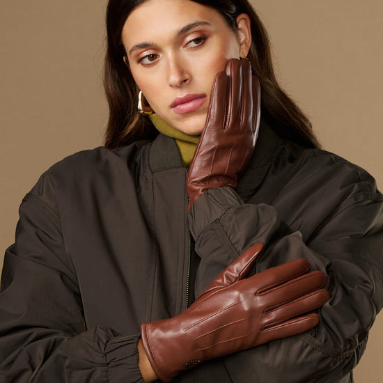 Cognac brown leather gloves with warm fleece lining, stitched seams, long cuff