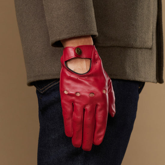 Men's red leather driving gloves with open thumb and buttoned wrist cuff