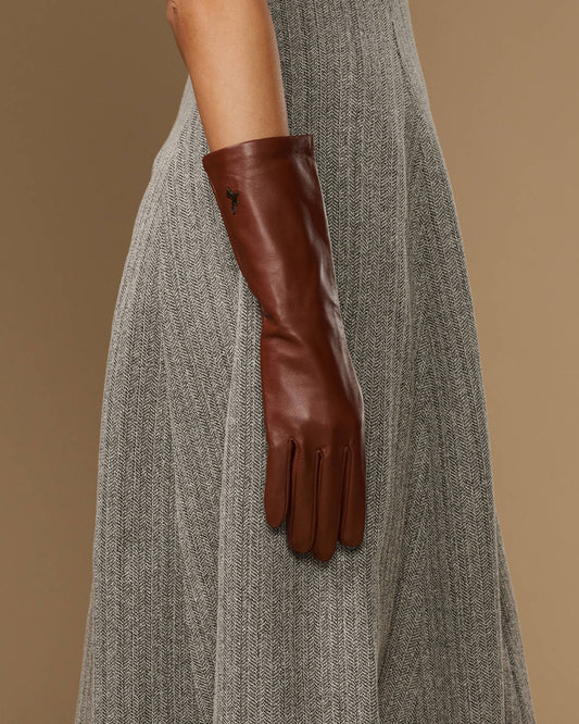 Chestnut brown mid-forearm leather gloves, close view of cuff and finger shaping