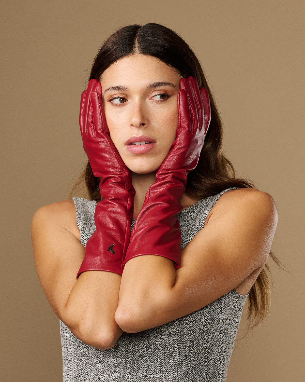 Women’s red below-elbow leather gloves with smooth finish and folded cuff detail