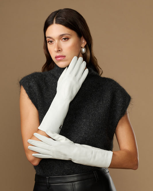 White mid-forearm lambskin leather gloves with smooth cuff, silk-lined look, logo detail