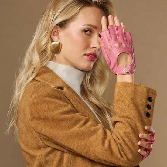 Pink fingerless lambskin driving gloves, side view with open fingers and snaps