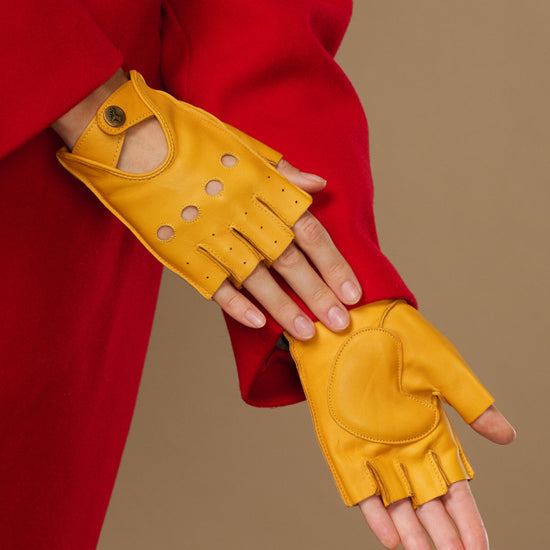 Yellow long fingerless leather driving gloves with thumb opening and button-cuff straps